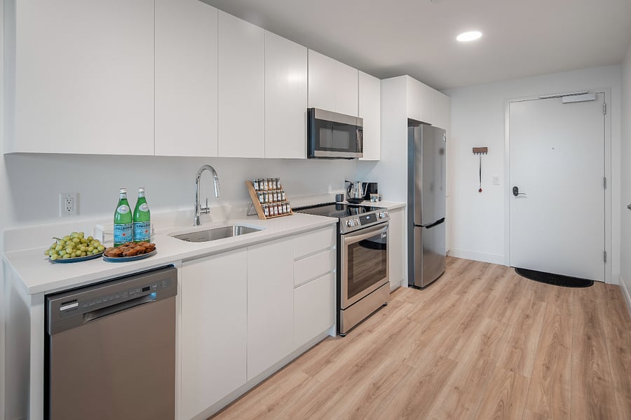 An elegantly appointed kitchen with a calming, open layout.
A perfect setting for both culinary inspiration and relaxed dining.