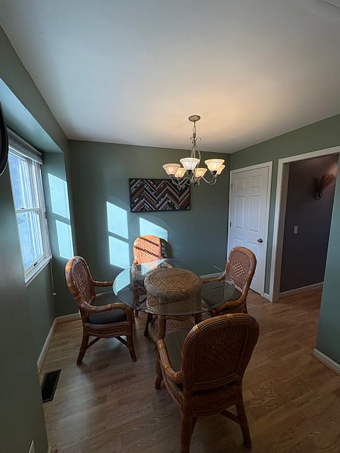 kitchen/dining. doorway leads to basement staircase