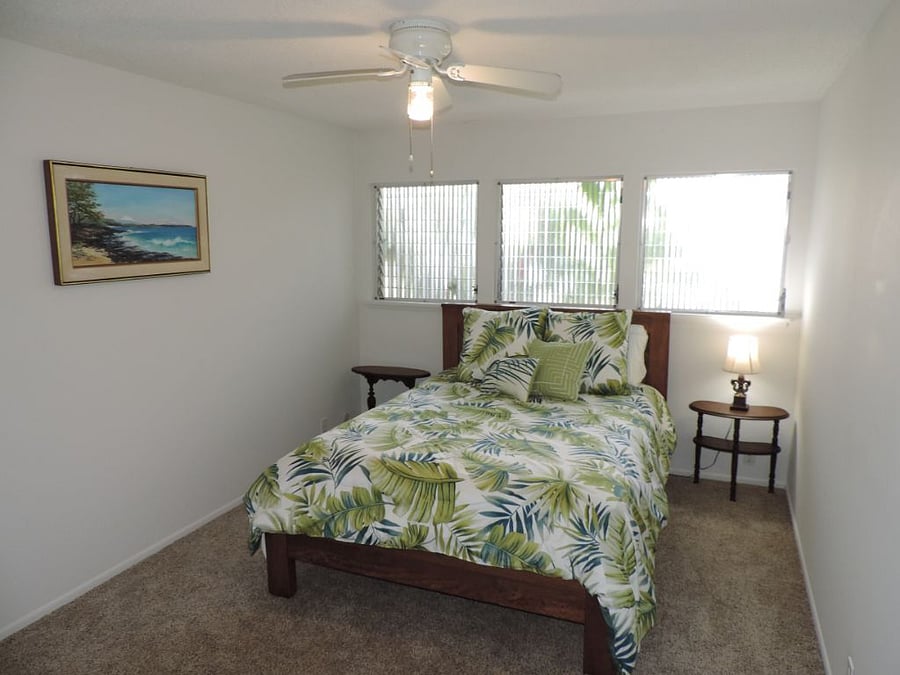 Guest bedroom 1 with a queen-size bed.
