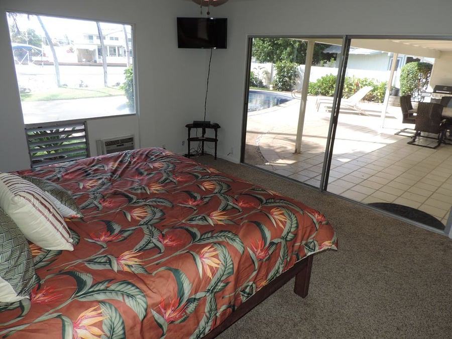 Primary Pool and marina view Bedroom with full bathroom.
