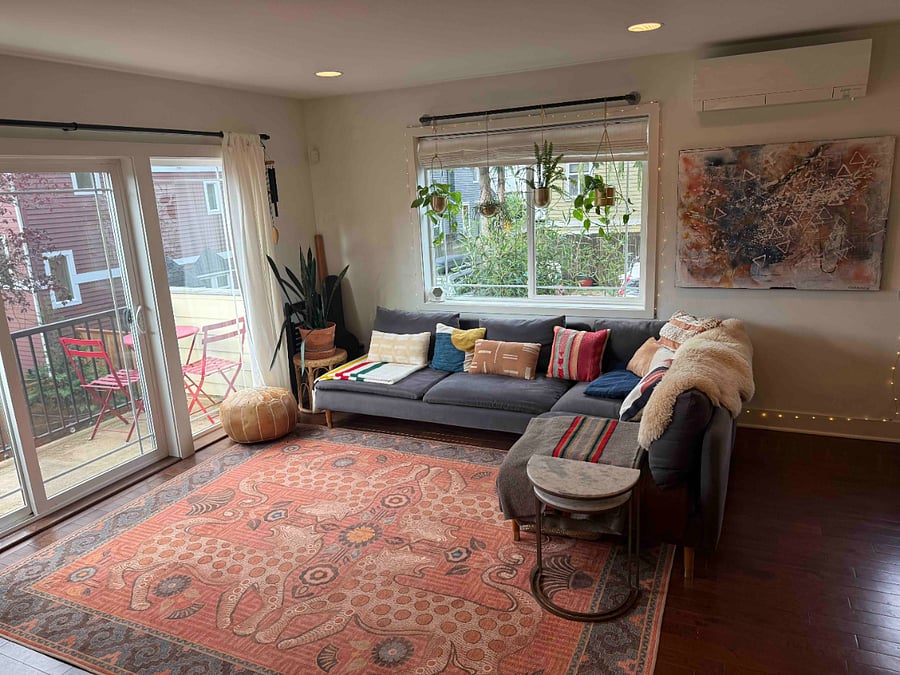 Shared open concept living room with balcony