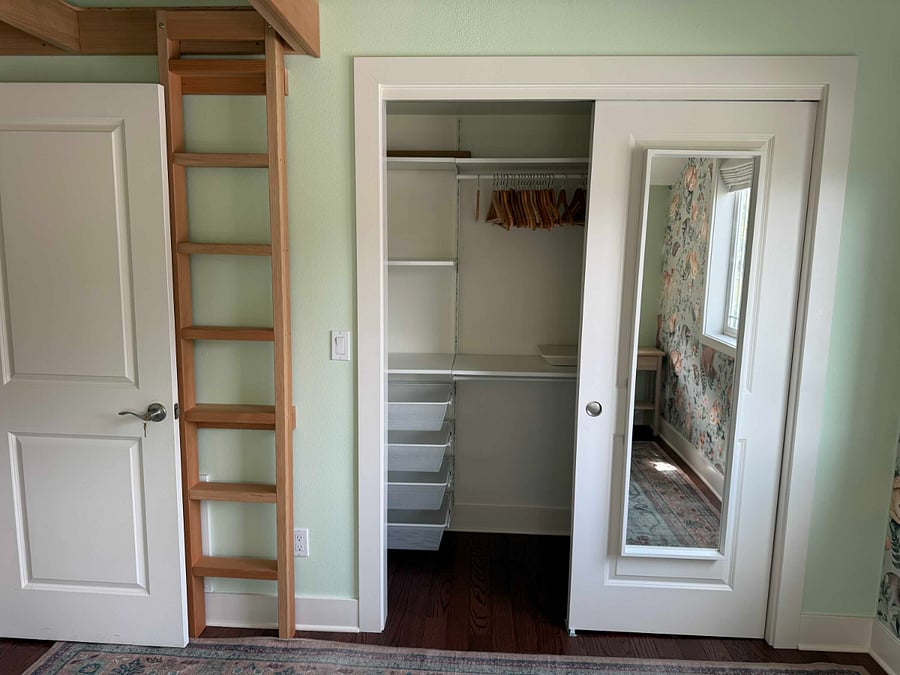 Plenty of closet space and ladder up to mezzanine bed
