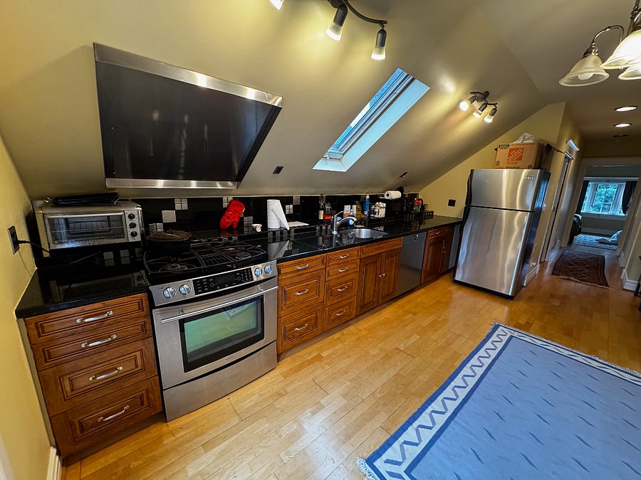 kitchen (gas stove), dining area (table absent in this photo)