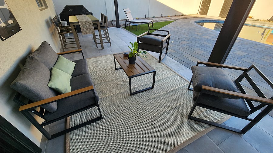 Inviting porch with sit down area and dining.