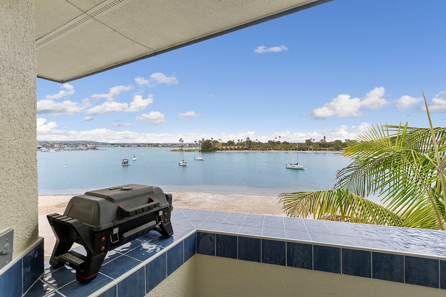 Deck with two chairs, propane grill and fabulous bayviews!