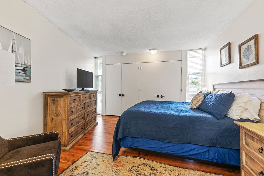 Primary bathroom with ensuite, king-size bed and TV