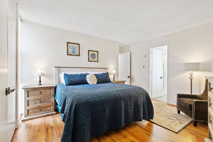 Primary bathroom with ensuite, king-size bed and TV