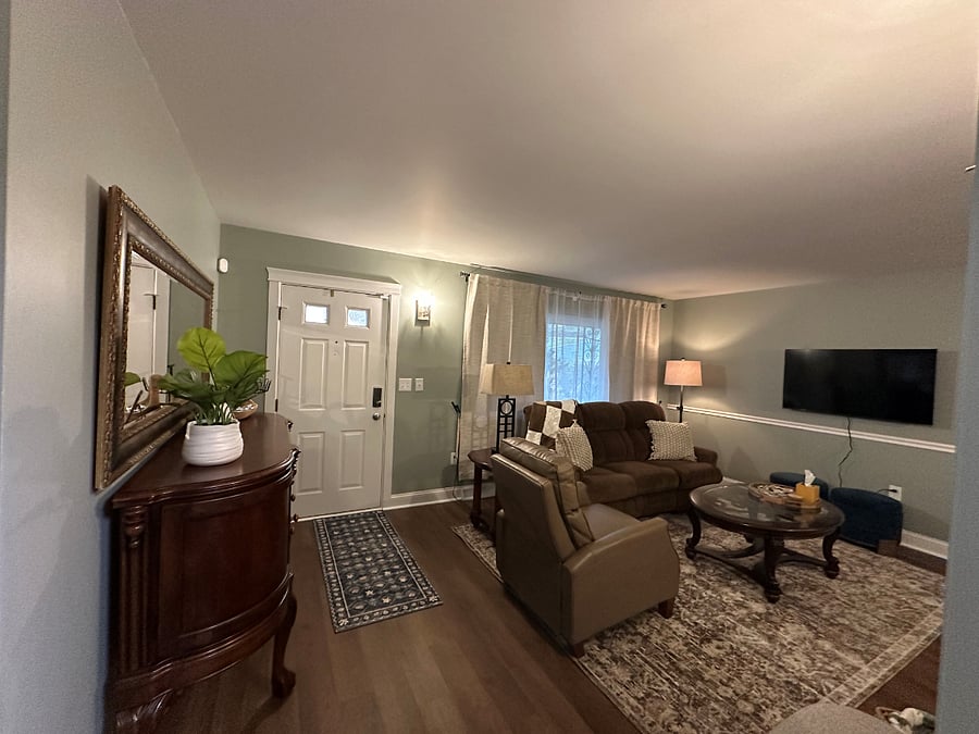 Living Room with TV, lazy boy couch and haverty recliner