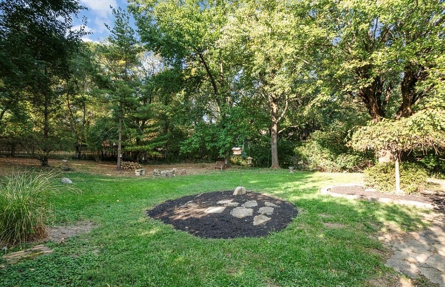 Rear of home, big back yard and fire pit