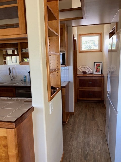 Bedroom 2 is just past the refrigerator and the main bathroom is to the left of the drawers at the end of the short hall and across from bedroom 2. Picture of bedroom 2 will follow when the room is finished.
