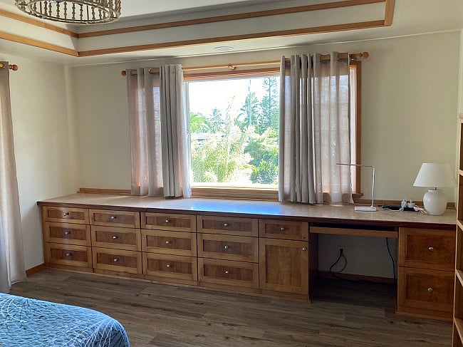 Opposite the bed in master bedroom.