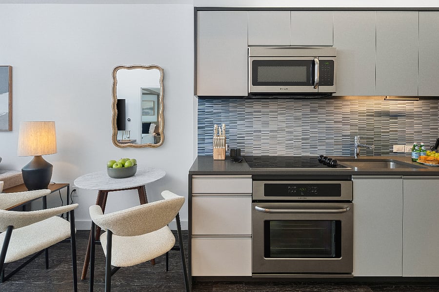 Sleek lines and elevated finishes define this chef-inspired kitchen.
Enjoy meals, moments, and memories around the elegant dining island.