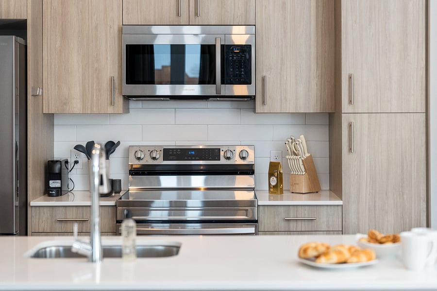 Bright, open, and thoughtfully arranged. This kitchen and dining island create the ideal setting for memorable stays.