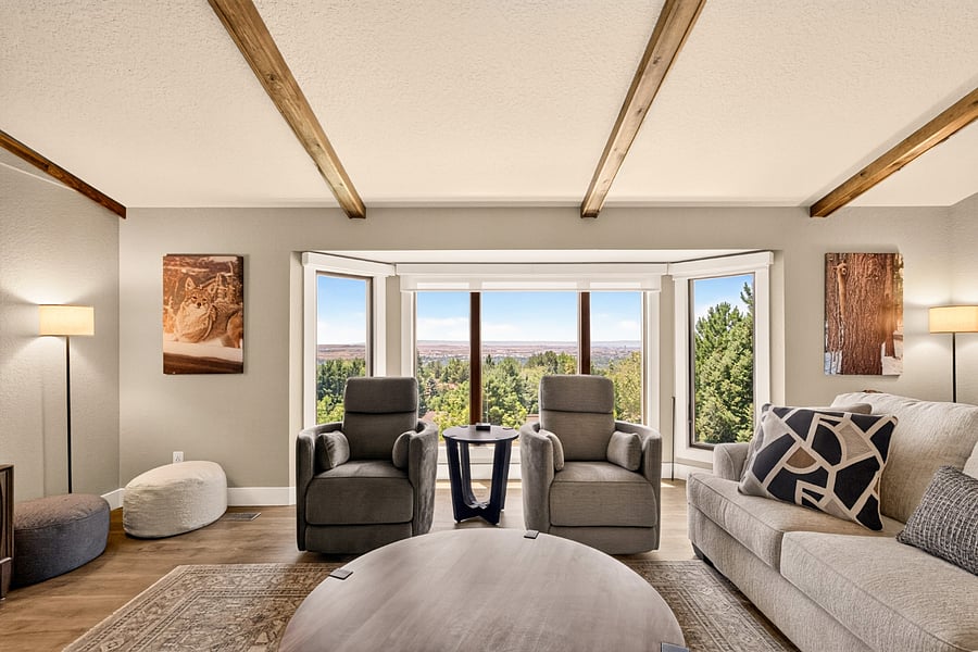 Enjoy panoramic Treasure Valley views from the comfort of the main living room. Large picture windows fill the space with natural light, while comfortable seating creates the perfect spot for morning coffee, reading, remote work, or relaxing after a long day