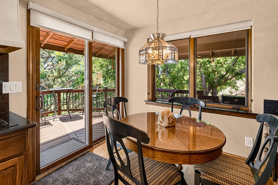 Kitchen breakfast nook and views of the private backyard.