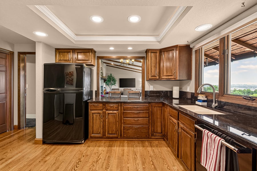 The spacious, fully equipped kitchen is designed for everyday living, with generous counter space, abundant cabinetry, modern appliances, and beautiful Treasure Valley views. Convenient access to the view deck makes outdoor dining and entertaining a natural extension of the home.