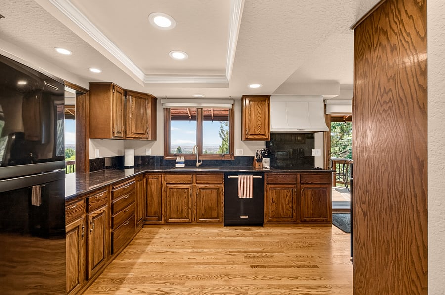 The spacious, fully equipped kitchen is designed for comfortable everyday living, featuring generous counter space, abundant cabinetry, and beautiful Treasure Valley views. Enjoy cooking with new KitchenAid appliances, including an Even-Heat True Convection wall oven, along with a blender, Instant Vortex Plus Air Fryer, Instant Pot Duo multi-cooker, coffee maker, Keurig, toaster oven, and all the cookware, dishes, and utensils needed for extended stays. Convenient access to the view deck makes outdoor dining and entertaining effortless.