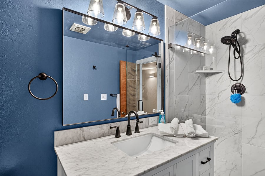 Lower level private bath with custom shower enclosure