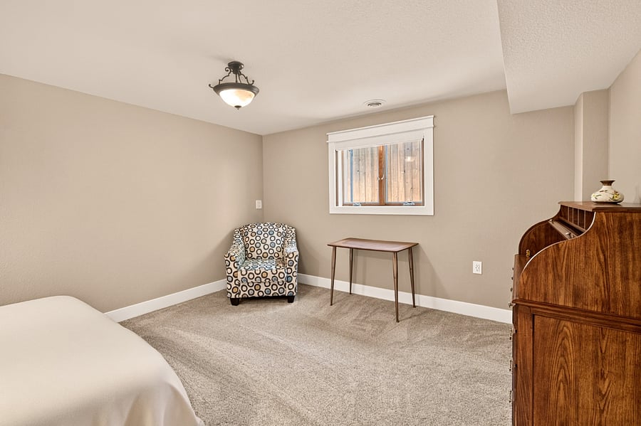 Lower level bedroom 4 with closet, sitting area and two work desks