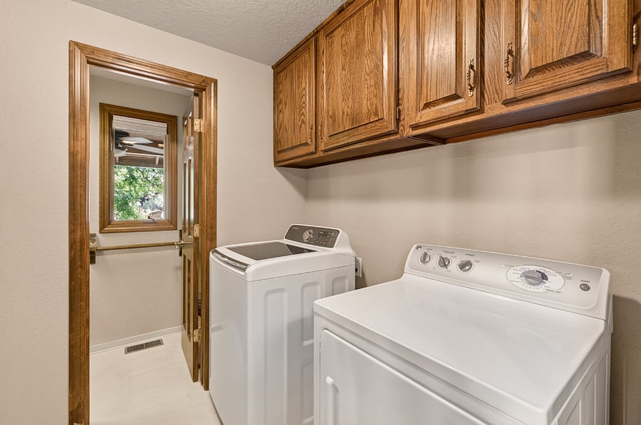 Main level utility room with washer/dryer and access to private 1/2 bath