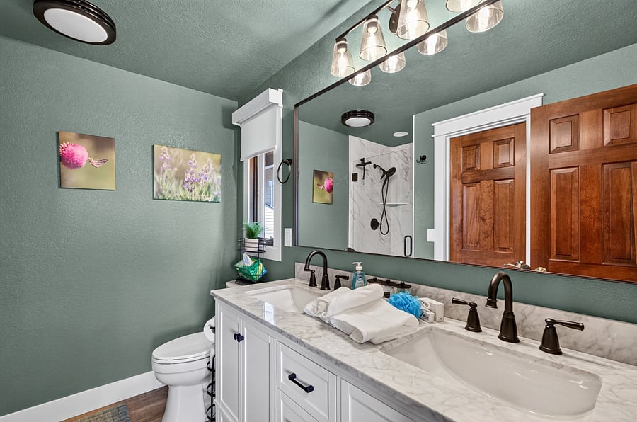 Master bathroom with double-sink, walk-in closet and custom shower