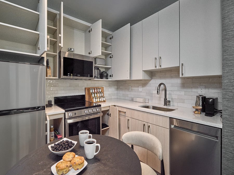 Sleek lines and elevated finishes define this chef-inspired kitchen.
Enjoy meals, moments, and memories around the elegant dining island.