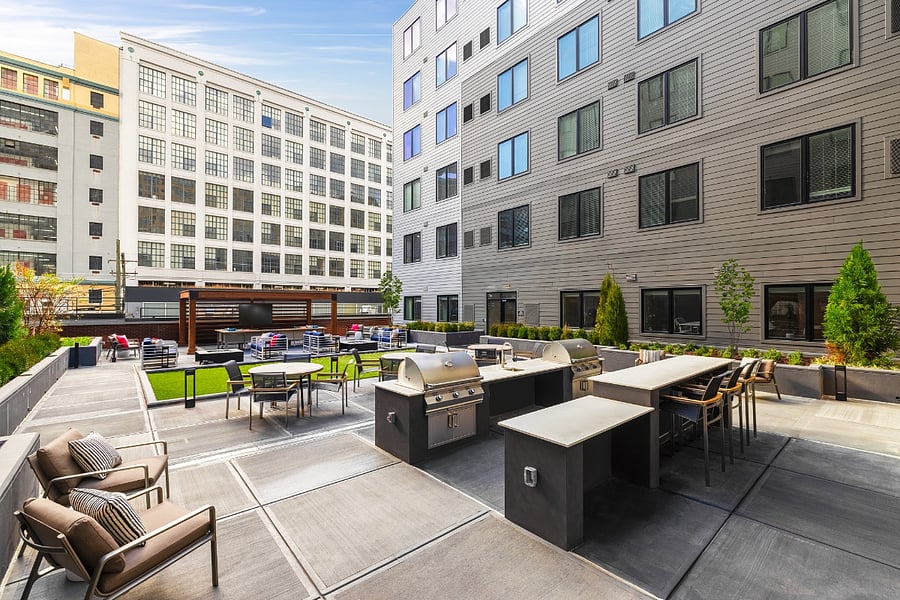 Outdoor courtyard view with BBQ utilities and seating to make your evenings enjoyable.