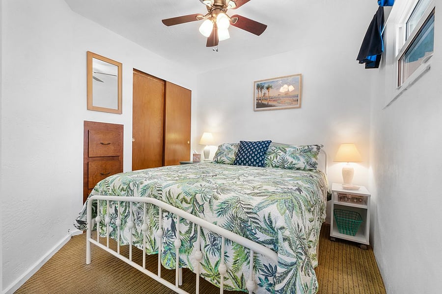 Queen size bed, closet, fan, window, room darkening shades