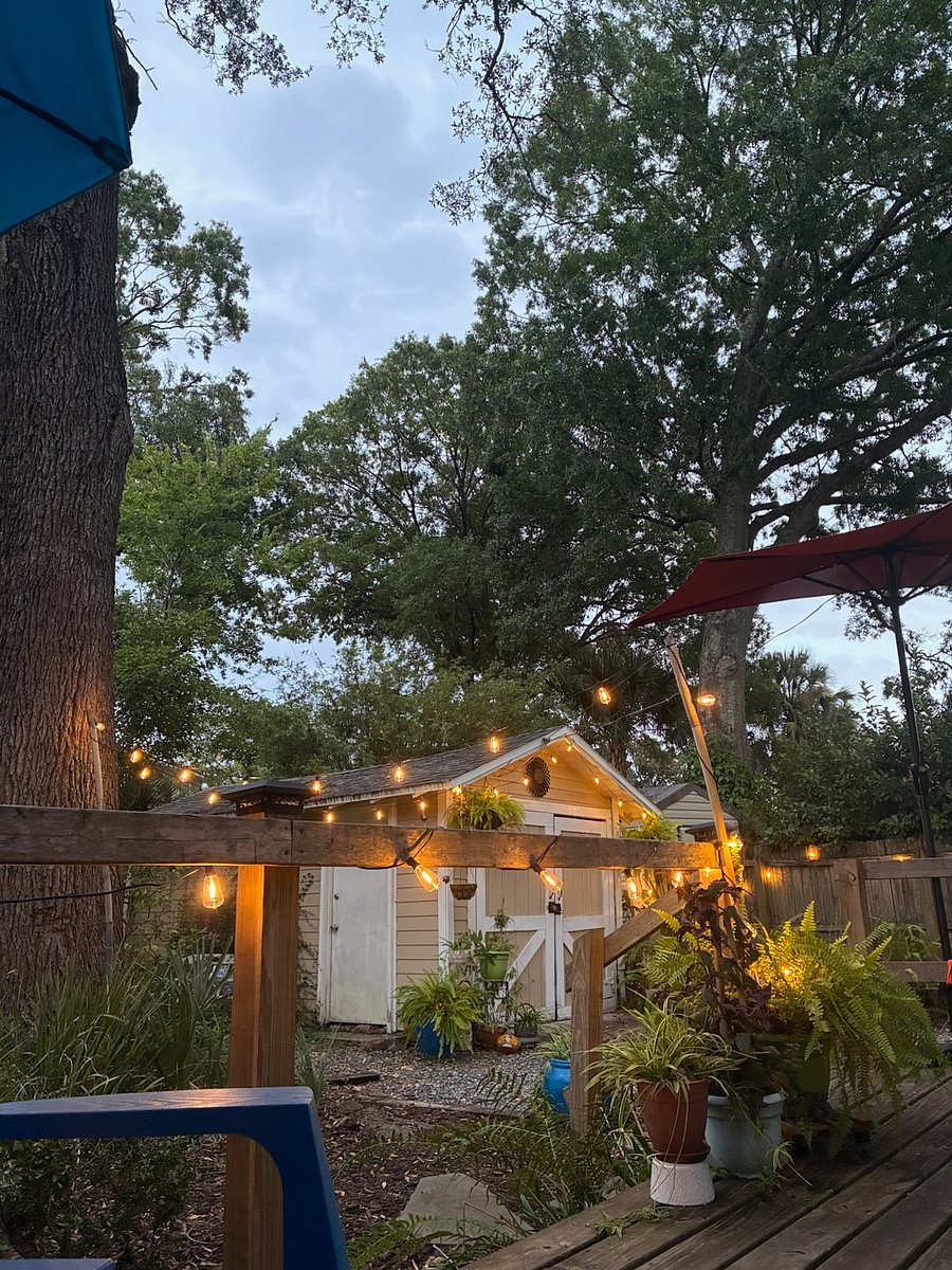 Private backyard with small deck, chaise lounge and chairs