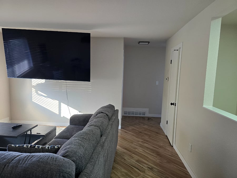 Upstairs family room with 75-inch TV. 