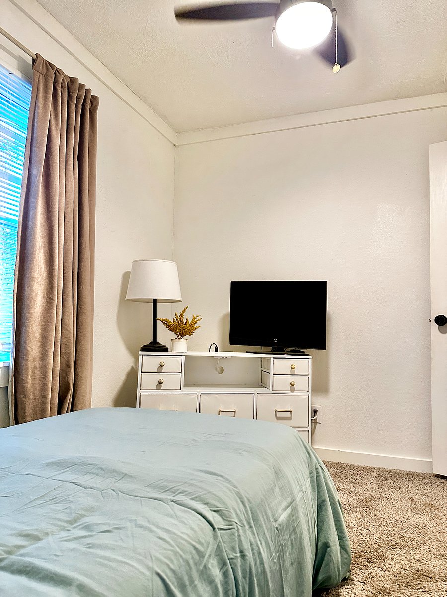 The "Sage Room" features a twin sized bed, with local artist work on the wall, small dresser with usb plugs to charge phones, small tv with local channels & closet.