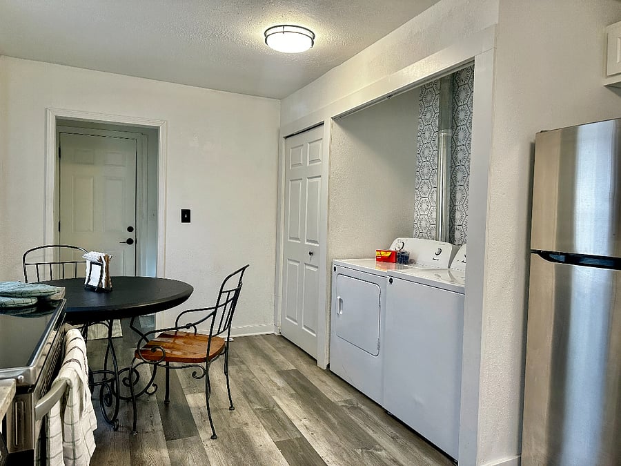 Large Pantry area for extra needs & the back door to the back deck of the house. 