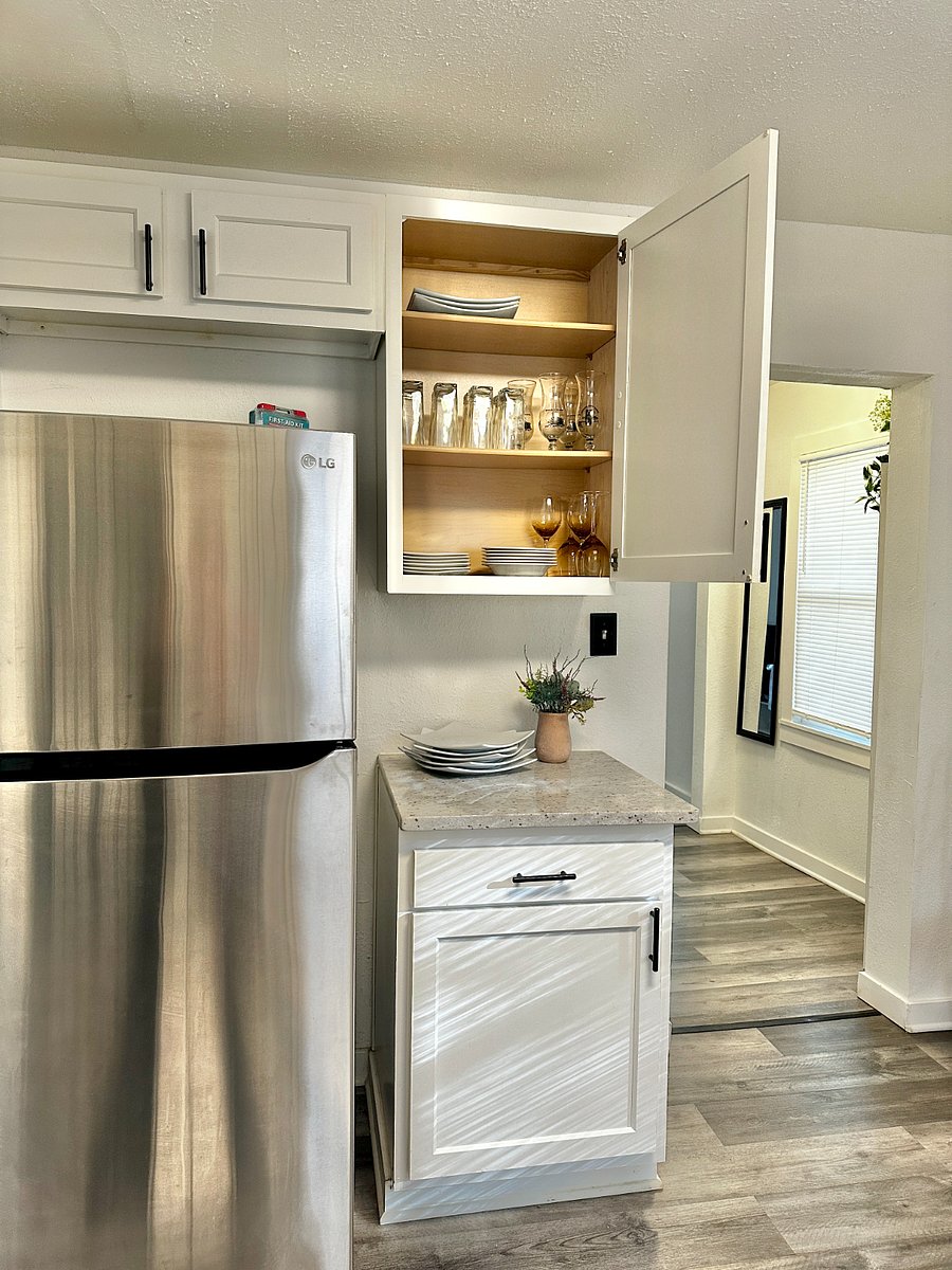 All the cutlery, plates, bowls, glasses, wine glasses & more ready for our guest tenants. 