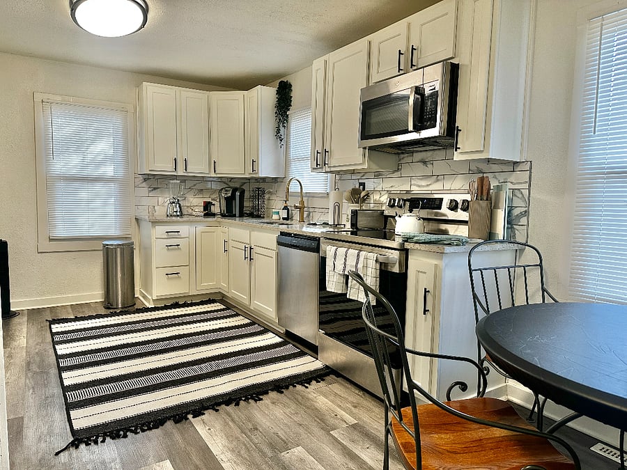 Nice sized Eat In Kitchen that's stocked ready to cook & bake with many great utensils & appliances. 
Blender, Keurig Machine, French Press, Water Kettle, pots, pans, baking sheet, measuring cups, & more.