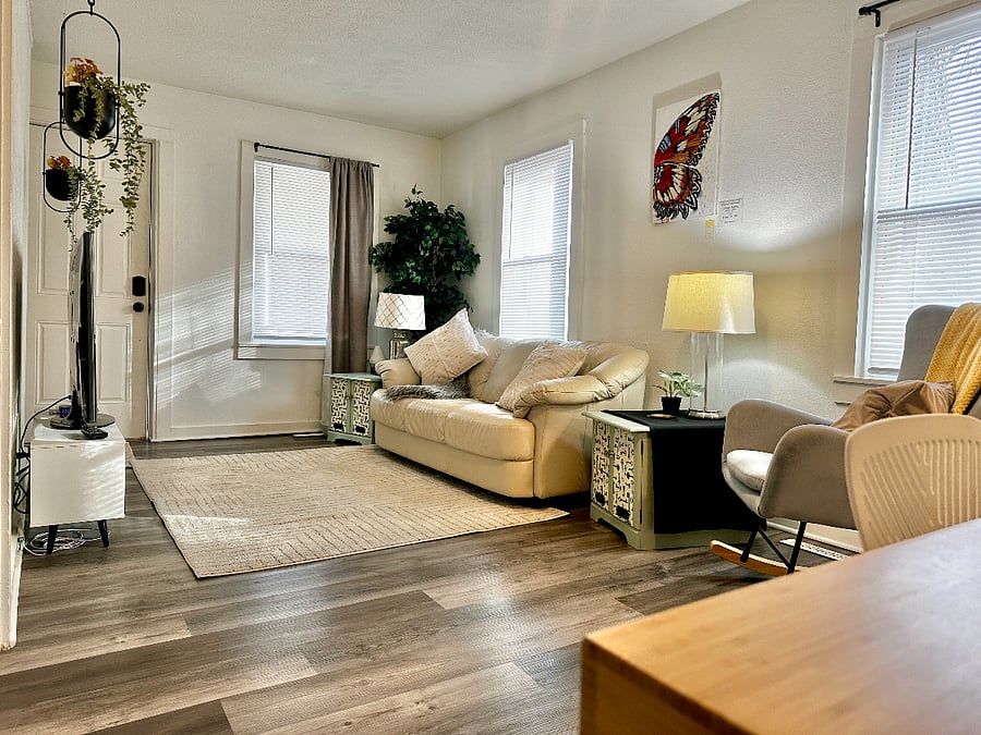 Living Room with local artist painting on display & for sale. 