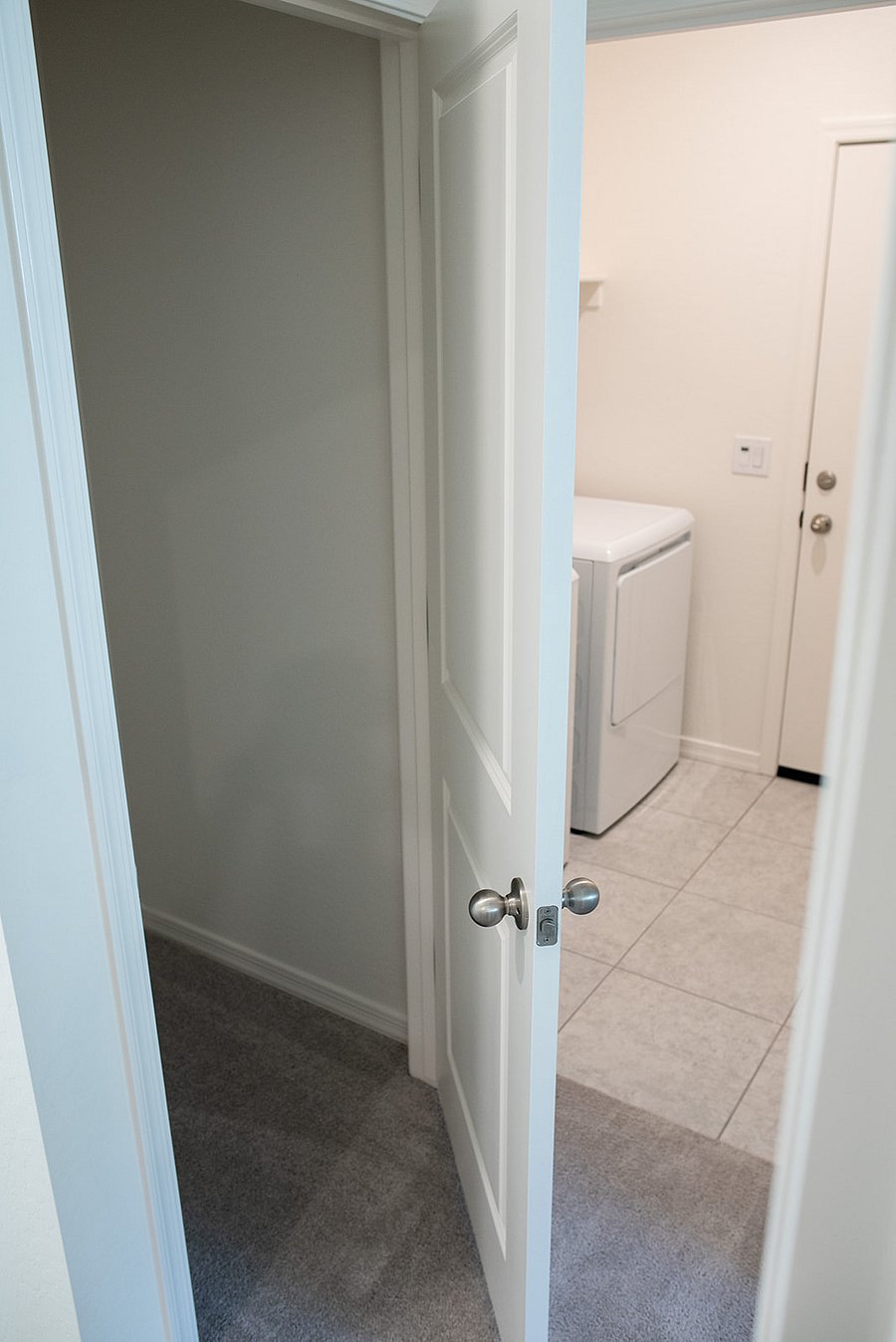 storage closet leading to laundry room
