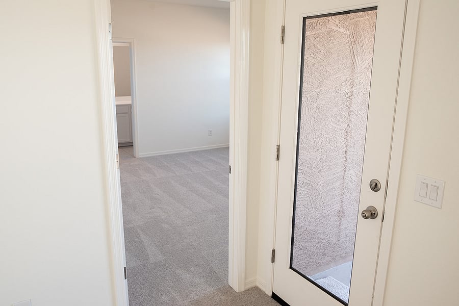 entry to master bedroom and door to backyard