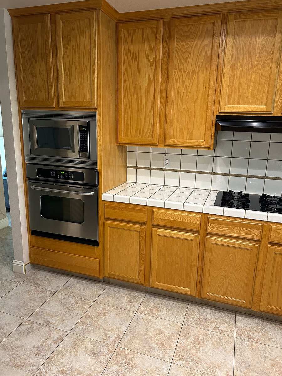 Shared kitchen with microwave, oven and range.