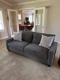 Private sitting room with lots of natural light, remote controlled ceiling fan with dimmable light.