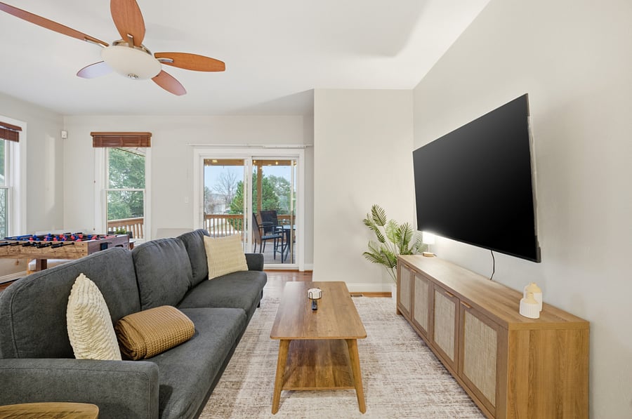Living room featuring wall-mounted TV and comfortable seating