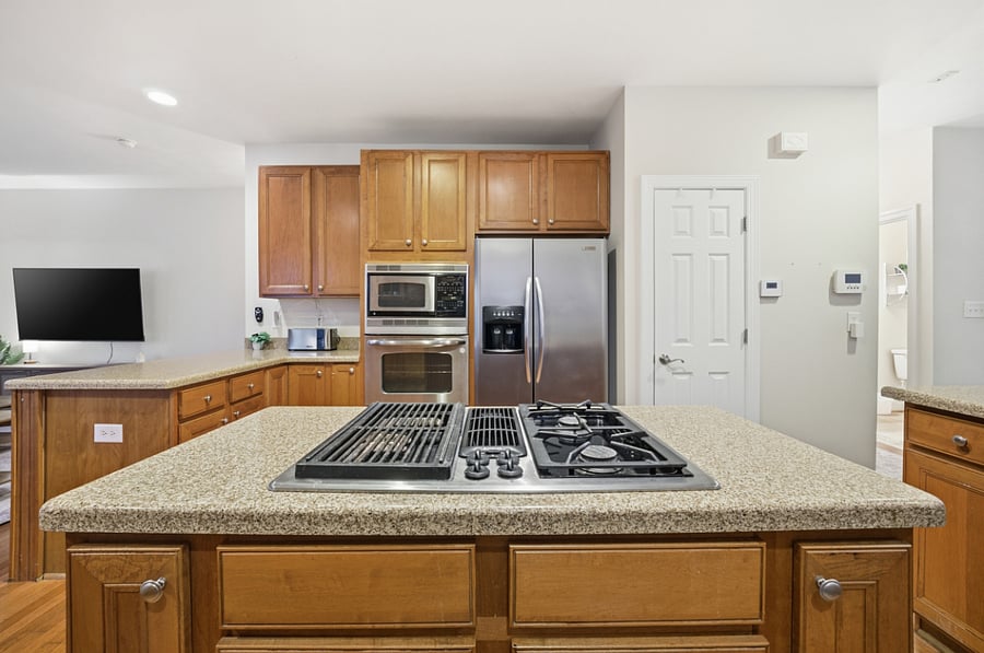 Large kitchen with open sightlines to living area