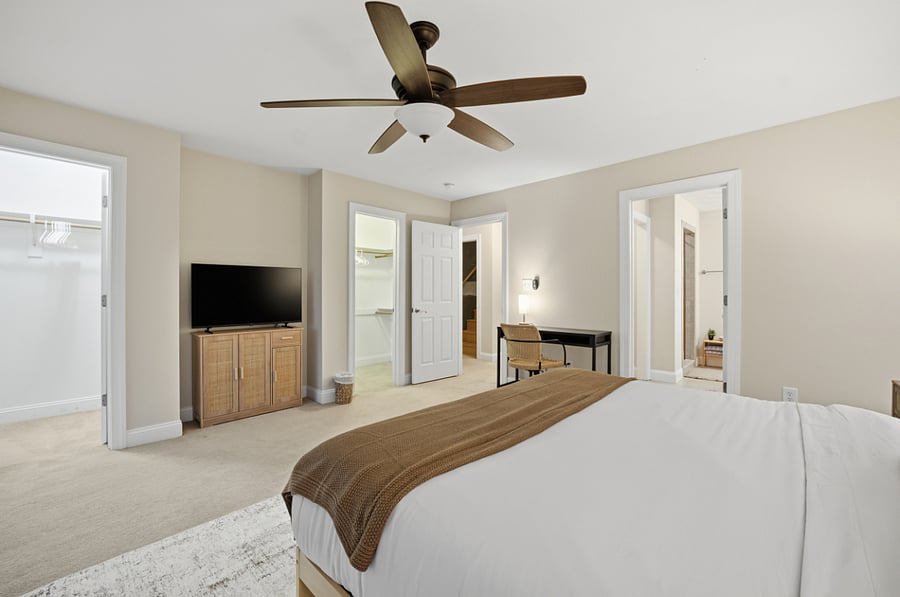 Bedroom with seating area and dresser
