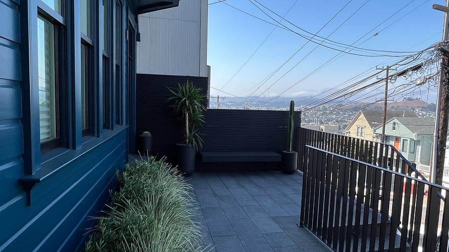 Front patio with floating bench adjacent to studio entry gate