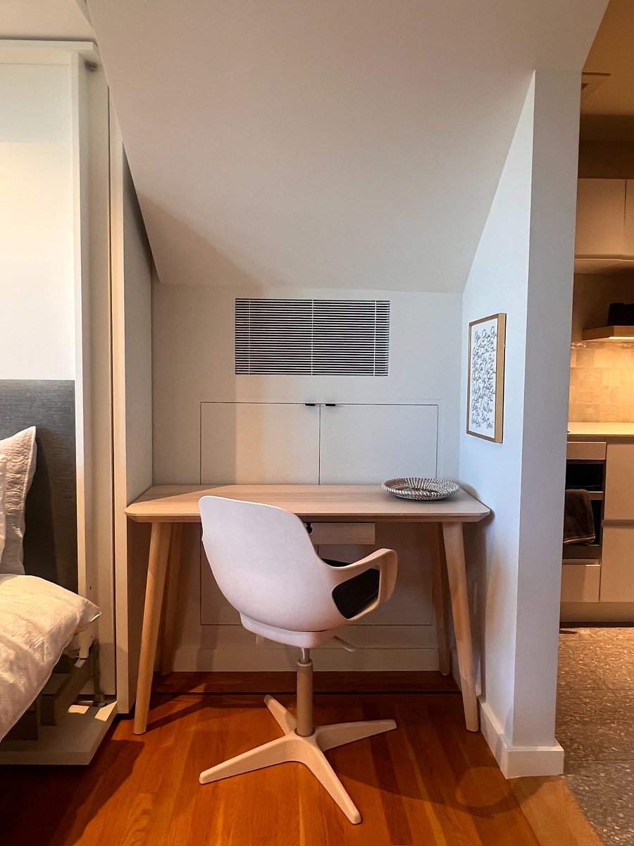 Desk with large under-stairs hidden storage space behind