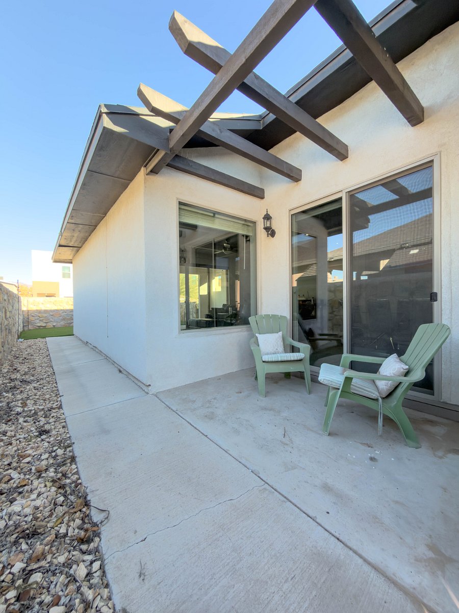 Lounge area on side of the house. Doors in front of dining area.