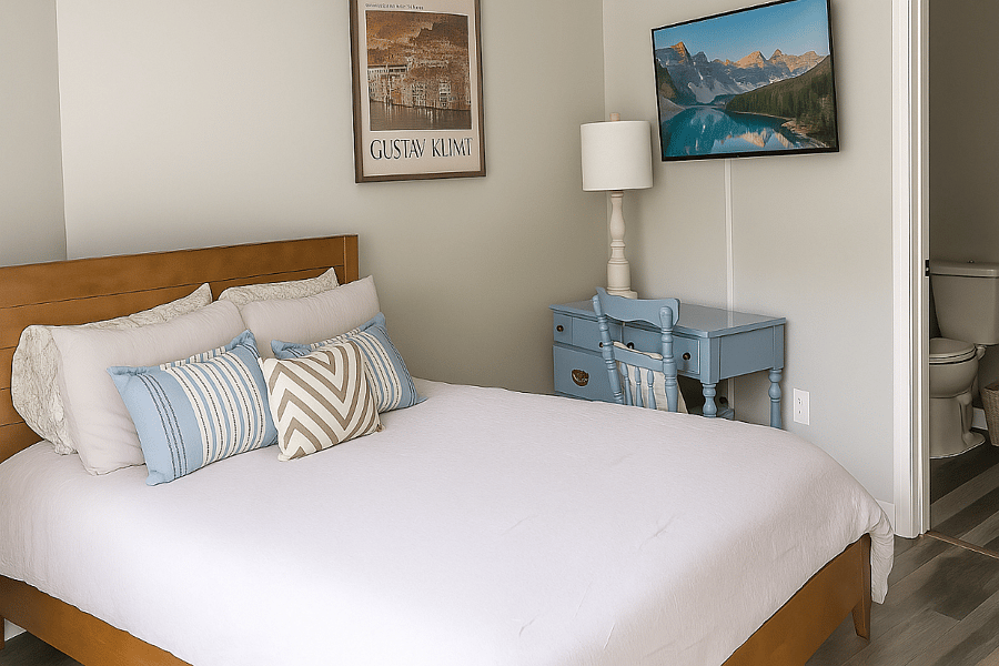Sink into a luxurious queen-sized bed with hotel-quality linens and blackout curtains for restful sleep.