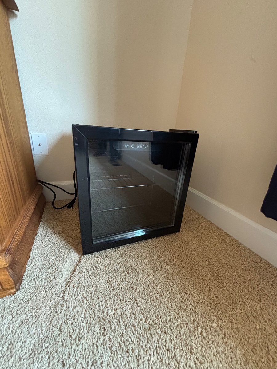 Mini fridge in bedroom