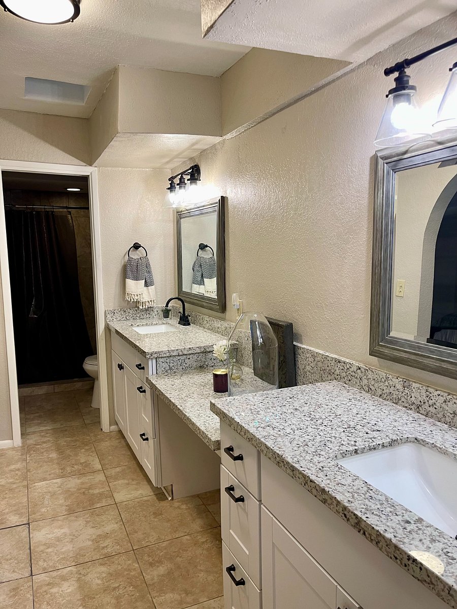 primary en suite bath with walk in shower & toilet on one end