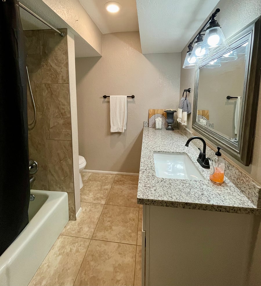 2nd hallway bathroom with large granite vanity & tub/shower