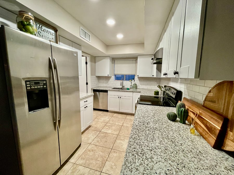 updated kitchen with fridge, dishwasher & granite countertops